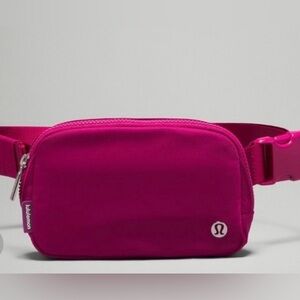 Lululemon berry colored Belt Bag. Great condition, no stains or scratches.